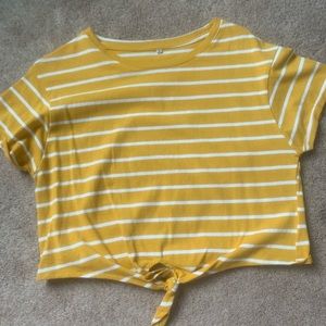 Mustard yellow and white striped, cropped shirt.